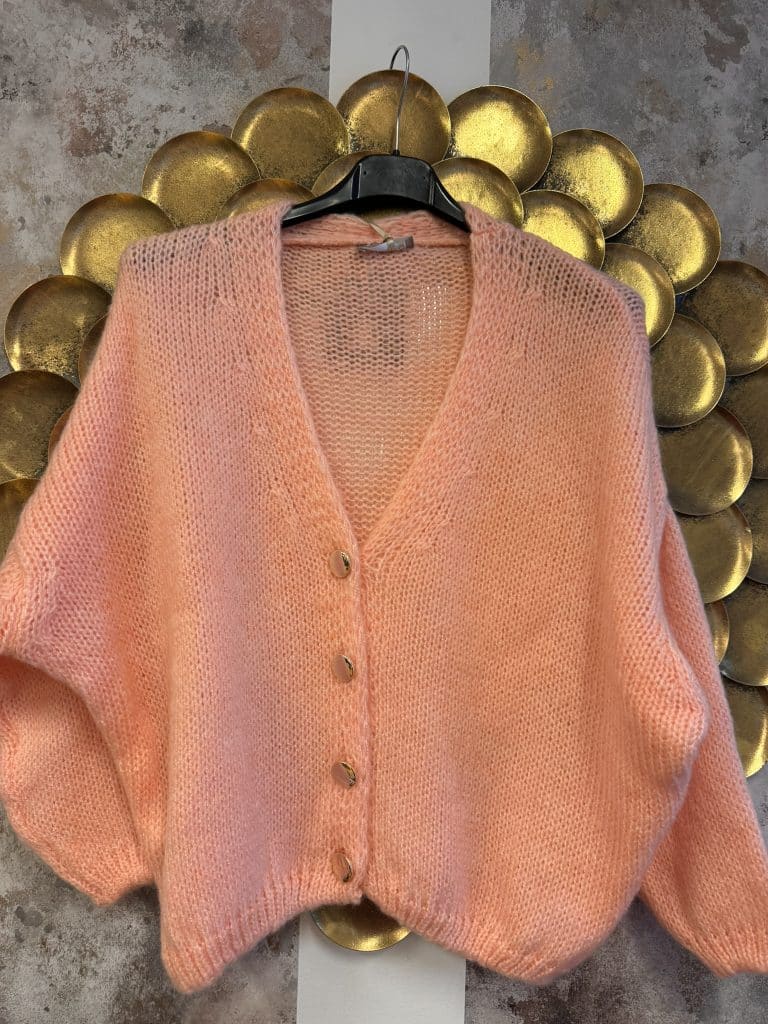 mysig kofta med guldknappar