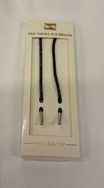 Lyxiga skosnören i glittrigt svart