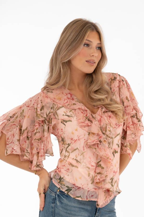 Blommig V-ringad blus med volangärmar