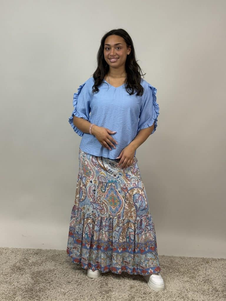 Ljusblå topp med volanger