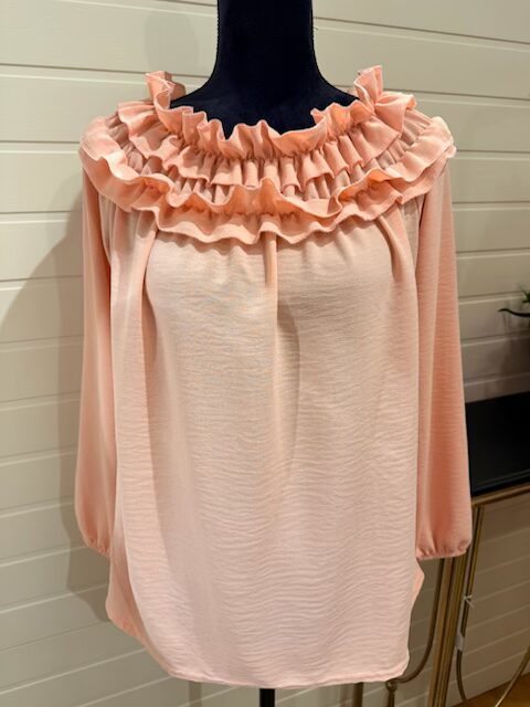 Cool tunika med volanger/krås runt halsen