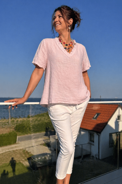 Linnetopp med volangkant i rosa