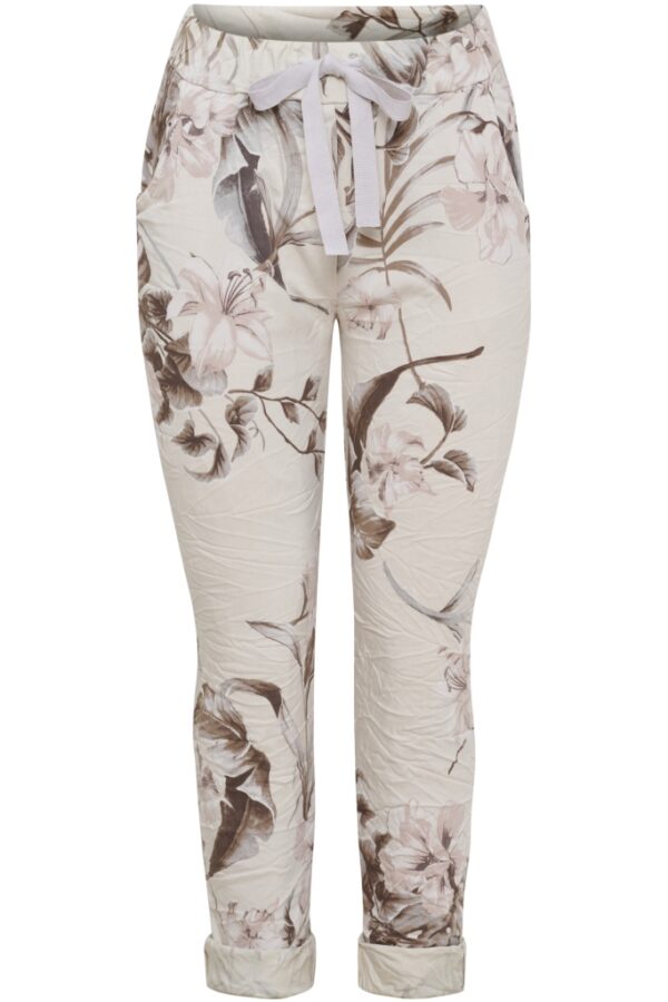 Magiska byxor med beige botten och blommor i brunt och nougat