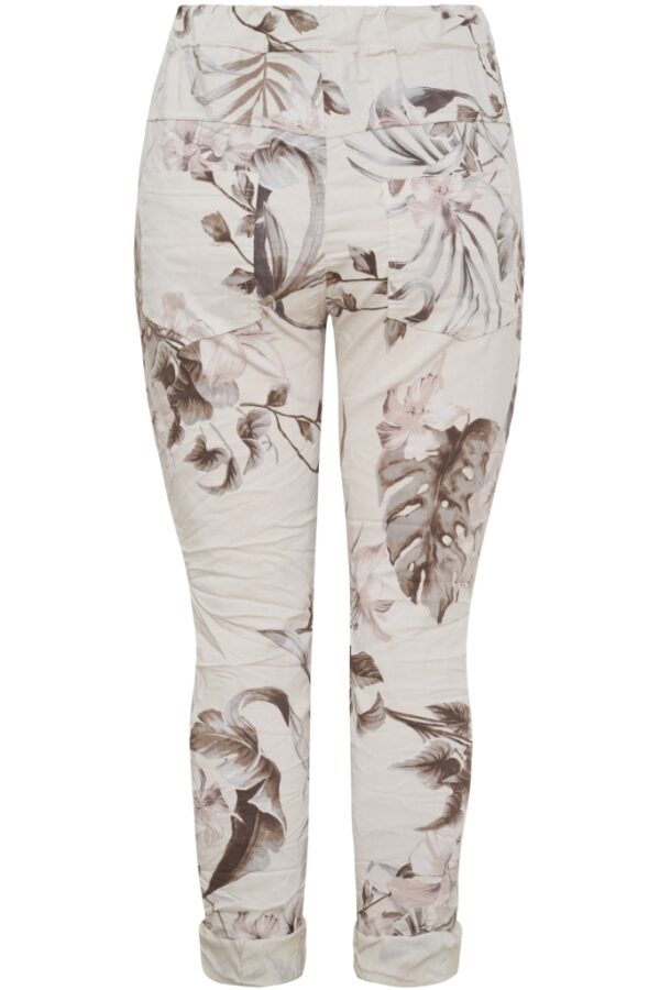 Magiska byxor med beige botten och blommor i brunt och nougat
