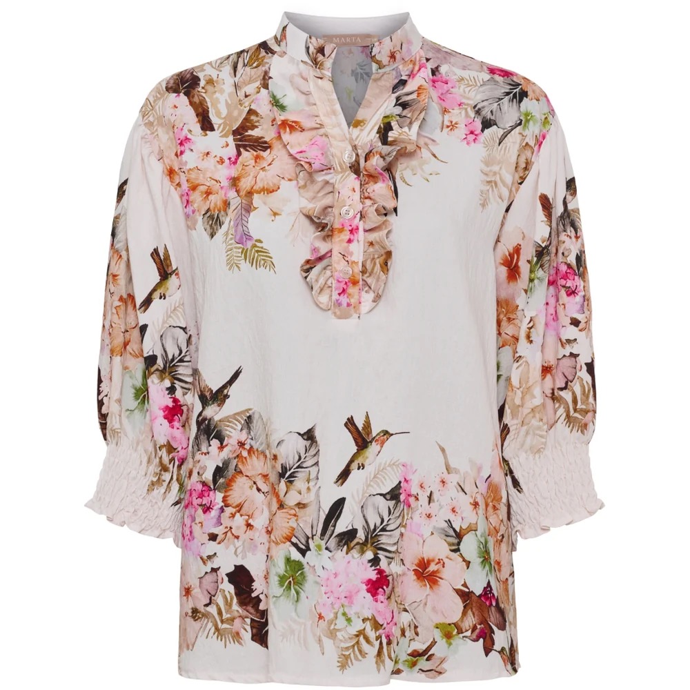 Fin blommönstrad blus med volang framtill