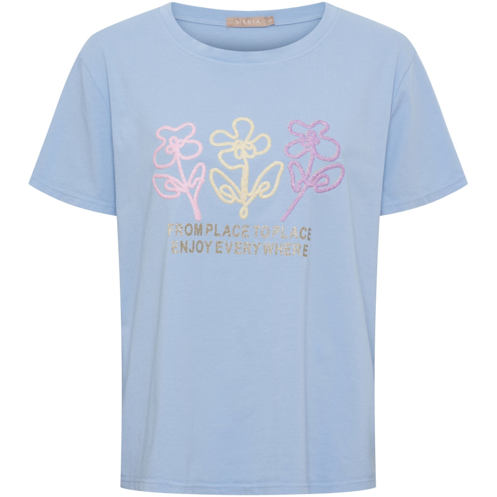 Ljusblå T-shirt med blommor